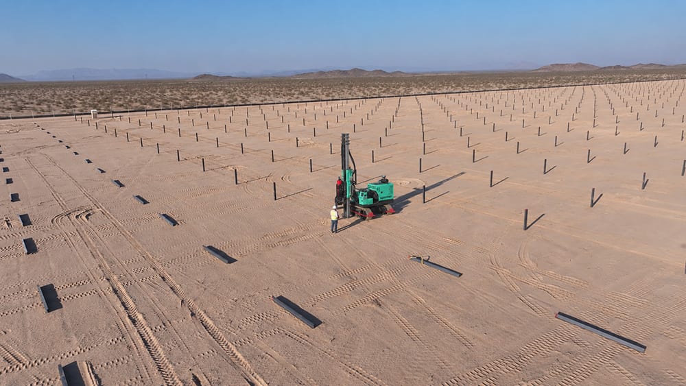 xpanner R6 robot drives piles on site.