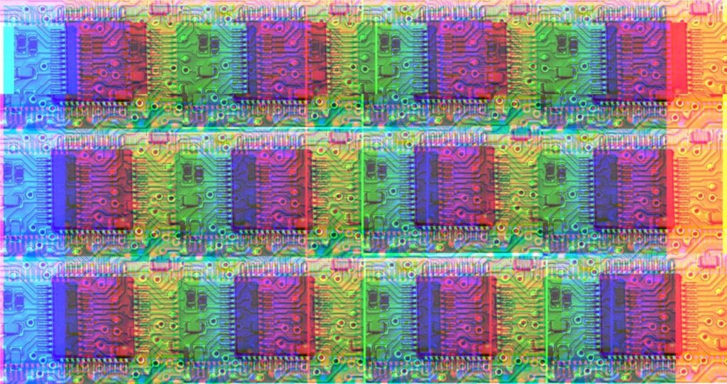 A repeating pattern of a photograph of a silicon chip, recoloured so that it is multi-coloured, in the style of pop art.